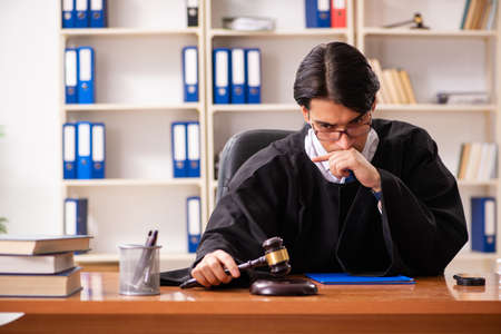 Young handsome judge working in courtの写真素材