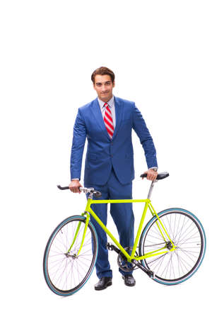 Young businessman using bike to commute to the officeの写真素材