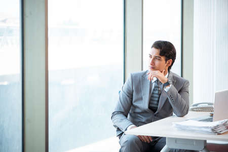 Young successful businessman working at the officeの写真素材