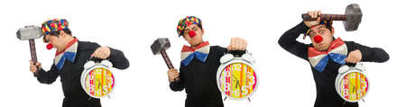 Funny clown with hammer and clock on whiteの写真素材