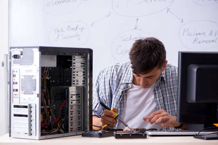 Young it specialist in front of the whiteboard