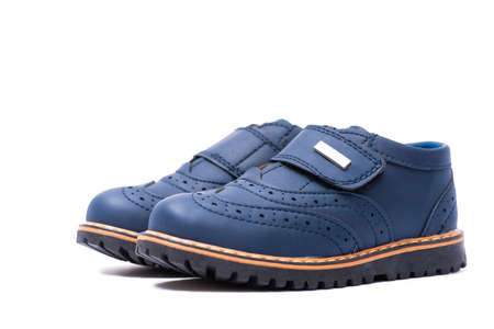 Blue baby shoes isolated on white backgroundの写真素材