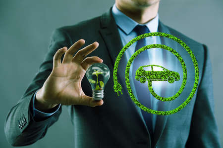 Electric vehicle concept with lightbulbの写真素材