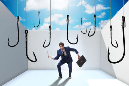 Businessman being tempted to bite the baitの写真素材