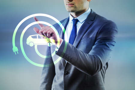 Businessman in electic vehicle concept