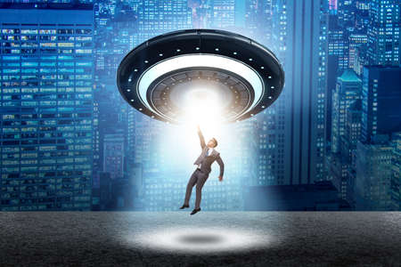 Flying saucer abducting young businessman