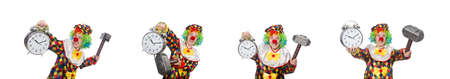 Clown with clock and hammer isolated on whiteの写真素材