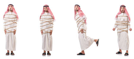 Arab businessman tied up with rope on whiteの写真素材