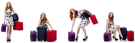 Beautiful woman in polka dot dress with suitcases isolated on whの写真素材