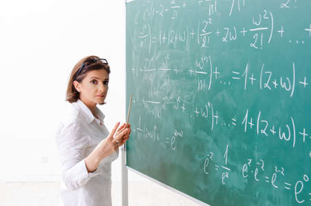 Female math teacher in front of the chalkboard