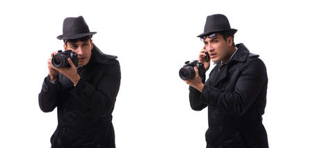 Spy with camera taking pictures isolated on white
