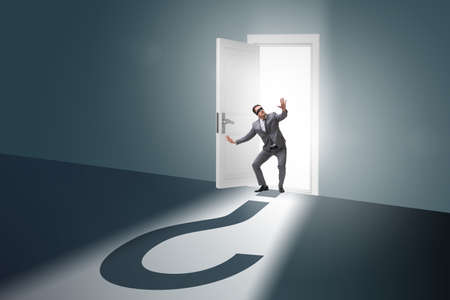 Businessman in uncertainty and question conceptの写真素材