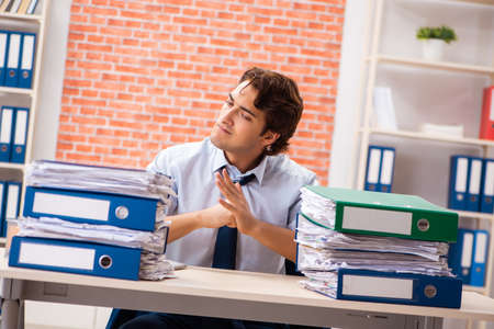 Young elegant man unhappy with too much work