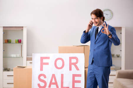 Young handsome realtor selling flatの写真素材