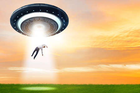 Flying saucer abducting young businessman