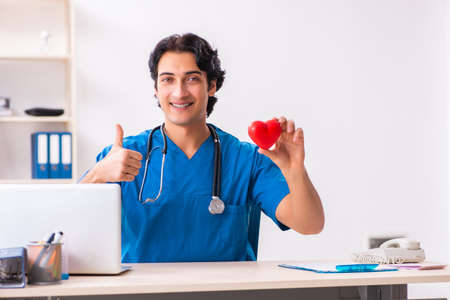 Young handsome doctor working at the clinicの写真素材