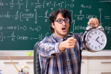 Funny male math teacher in the classroomの写真素材