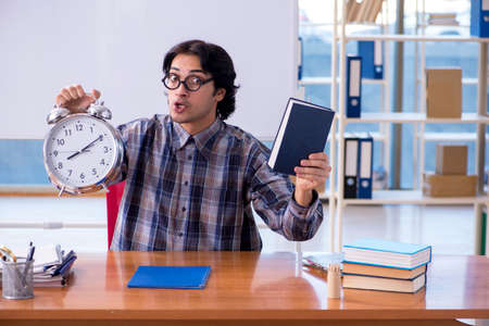 Funny male teacher in front of whiteboardの写真素材