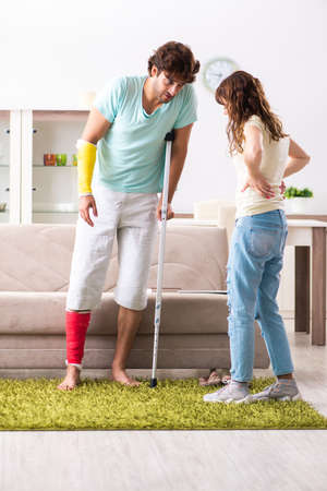 Young family helping each other after injuryの写真素材