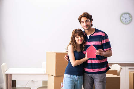 Young family moving to new house apartment