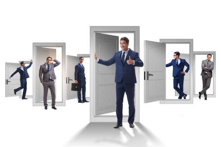 Businessman in uncertainty concept with many doorsの写真素材
