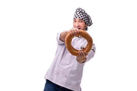 Young male baker isolated on white