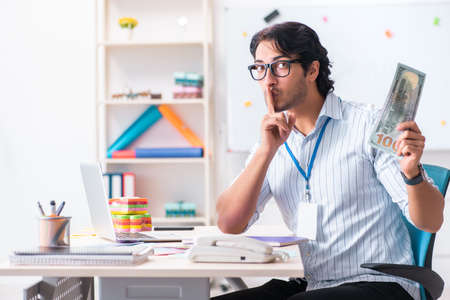 Young handsome male designer working in the officeの写真素材