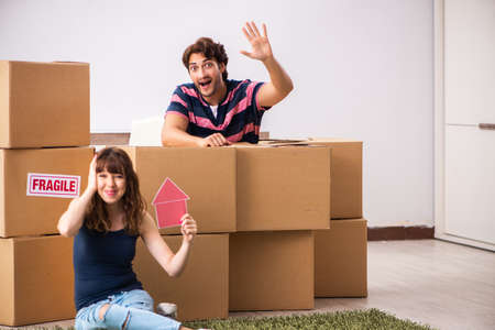 Young family moving to new house apartment