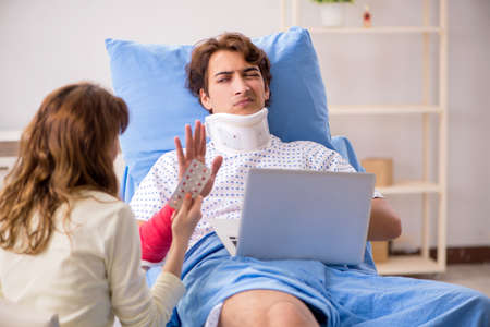 Loving wife looking after injured husband in hospital