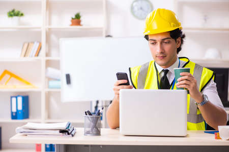 Male construction engineer working in the office