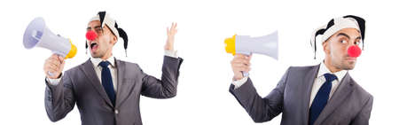 Funny clown businessman with megaphoneの写真素材