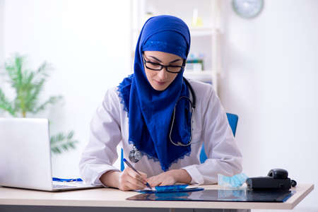 Arab female doctor working in the clinicの写真素材