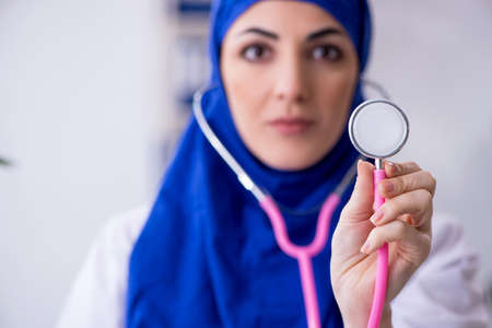 Arab female doctor working in the clinicの写真素材