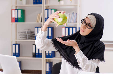 Female employee in hijab working in the officeの写真素材
