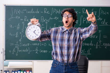 Funny male math teacher in the classroomの写真素材