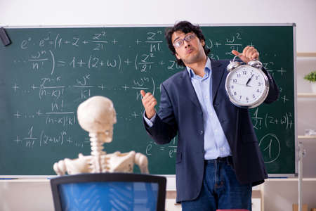 Young male math teacher and student skeletonの写真素材
