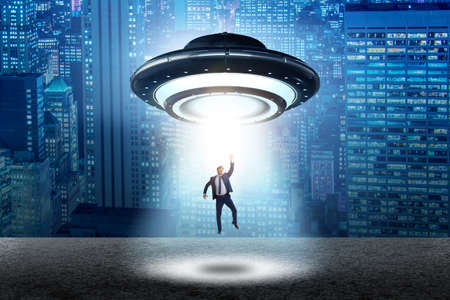 Flying saucer abducting young businessman