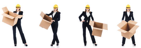 Woman builder with box isolated on whiteの写真素材