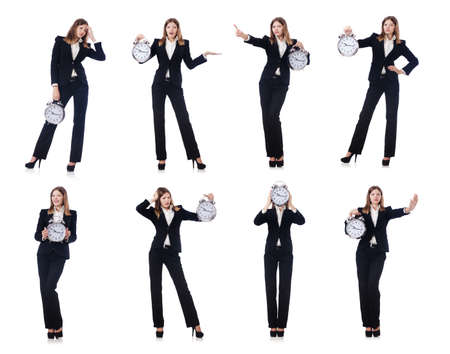 Businesswoman with clock isolated on white backgroundの写真素材