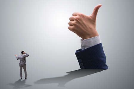 Businessman showing thumbs up gestureの写真素材