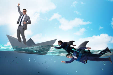 Businessmen in competition concept with sharkの写真素材