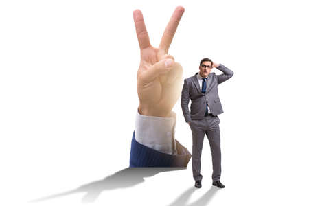 Businessman showing victory gesture in business conceptの写真素材