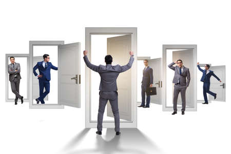 Businessman in uncertainty concept with many doorsの写真素材