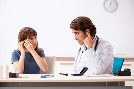 Patient with hearing problem visiting doctor otorhinolaryngologi