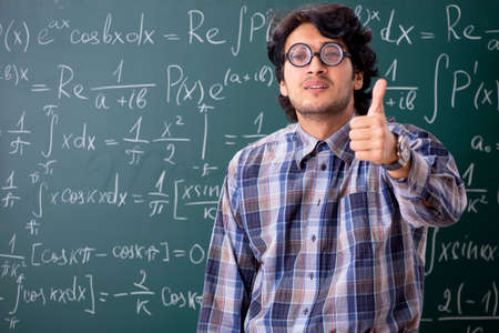 Funny male math teacher in the classroomの写真素材