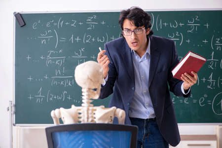Young male math teacher and student skeletonの写真素材