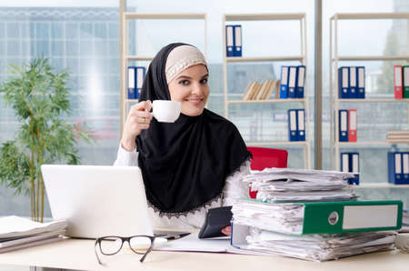 Woman muslim employee working in the officeの写真素材