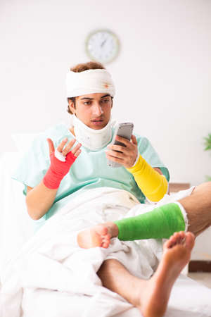 Young injured man staying in the hospitalの写真素材
