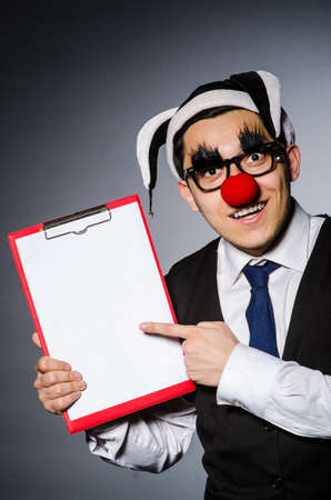Funny clown against dark backgroundの写真素材
