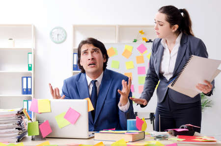 Two colleagues employees working in the officeの写真素材